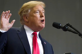 In this Nov. 26, 2018, photo, President Donald Trump speaks at a rally in Biloxi, Miss. Trump said Tuesday, Nov. 27, that he was “very disappointed” that General Motors was closing plants in the United States and warned that the White House was “now looking at cutting all GM subsidies,” including for its electric cars program.