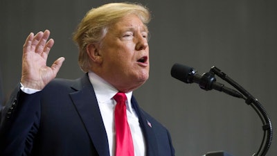 In this Nov. 26, 2018, photo, President Donald Trump speaks at a rally in Biloxi, Miss. Trump said Tuesday, Nov. 27, that he was “very disappointed” that General Motors was closing plants in the United States and warned that the White House was “now looking at cutting all GM subsidies,” including for its electric cars program.