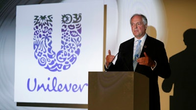 In this Thursday, May 18, 2017, file photo the Dutch CEO of Unilever Paul Polman gives a speech at the launch of the New Plastics Economy Innovation Prize at the Saatchi Gallery in London. The Anglo-Dutch company announced Polman's retirement by the end of 2018 early Thursday, the announcement comes months after Unilever, under pressure from shareholders, reversed a decision to consolidate its headquarters in Rotterdam.