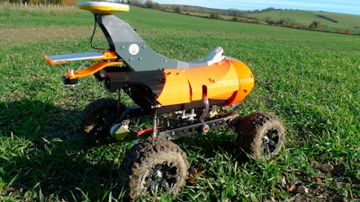 A farming robot named 'Tom' produced by Small Robot Company as part of a field trial to develop new farm technologies, in East Meon, southern England, Friday Nov. 30, 2018. The “agri-tech” startup company is developing lightweight autonomous machines that can carry out precision “seeding, feeding and weeding” in the hope of transforming food production.