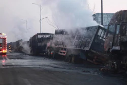 In this photo released by Xinhua News Agency, firefighters try to extinguish burning vehicles in the aftermath of an explosion at a plant operated by the Hebei Shenghua Chemical Industry Co. Ltd that destroyed dozens of vehicles nearby on Wednesday, Nov. 28, 2018 in Zhangjiakou city, northeastern China's Hebei province.