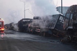 In this photo released by Xinhua News Agency, firefighters try to extinguish burning vehicles in the aftermath of an explosion at a plant operated by the Hebei Shenghua Chemical Industry Co. Ltd that destroyed dozens of vehicles nearby on Wednesday, Nov. 28, 2018 in Zhangjiakou city, northeastern China's Hebei province.