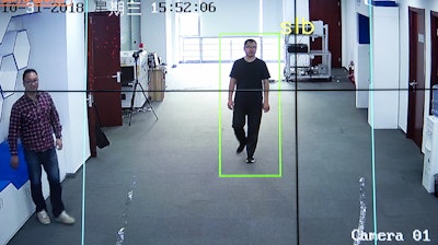 In this Oct. 31, 2018, photo, Huang Yongzhen, CEO of Watrix, demonstrates the use of his firm's gait recognition software at his company's offices in Beijing. A Chinese technology startup hopes to begin selling software that recognizes people by their body shape and how they walk, enabling identification when faces are hidden from cameras. Already used by police on the streets of Beijing and Shanghai, “gait recognition” is part of a major push to develop artificial-intelligence and data-driven surveillance across China, raising concern about how far the technology will go.