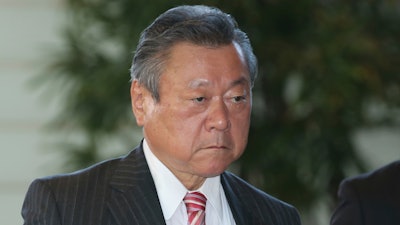 In this Oct. 2, 2018, file photo, Japan's Minister in Charge of Tokyo Olympics Yoshitaka Sakurada arrives at the prime minister's official residence in Tokyo. Sakurada, also the minister in charge of cybersecurity, is in the spotlight for acknowledging he had never used a computer and making comments showing he had no idea what a USB port might be.