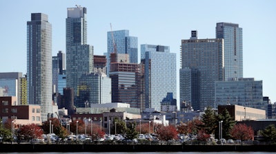 In this Wednesday, Nov. 7, 2018, photo, the Long Island City waterfront and skyline are shown in the Queens borough of New York. One of the areas that Amazon is considering for a headquarters is Long Island City. An old manufacturing area, it's cultivating a new image as a hub for 21st-century industry, creativity, and urbane living.