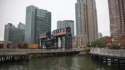 A former dock facility is shown with old transfer bridges, with 'Long Island' painted in large letters at Gantry State Park in the Long Island City section of Queens, N.Y., Tuesday Nov. 13, 2018, in New York. Amazon announced Tuesday it has selected the Queens neighborhood as one of two sites for its headquarters.