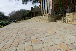This Nov. 24, 2018 photo shows a stone pavers driveway in a residential neighborhood in Dallas, Texas. One driveway at a time, many homeowners and communities are opting for permeable paving options instead of traditional asphalt.