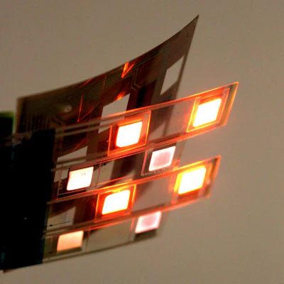 The sensor is assembled from a printed sheet of organic photo detectors (top) and organic red and infrared LEDs (bottom).