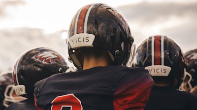 In this photo provided by VICIS, youth football players wear the company's new youth helmets during a helmet test-fitting and practice in Seattle, date not known. VICIS, a company that already makes helmets for NFL football professional players, is bringing its youth helmet to market with investment from several NFL players, including Green Bay Packers quarterback Aaron Rodgers.