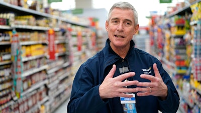 In this Friday, Nov. 9, 2018, photo Walmart U.S. President and CEO Greg Foran talks about the technology the company is using to keep shelves stocked at a Walmart Supercenter in Houston. Foran took over as CEO of the discounter’s U.S. division four years ago.