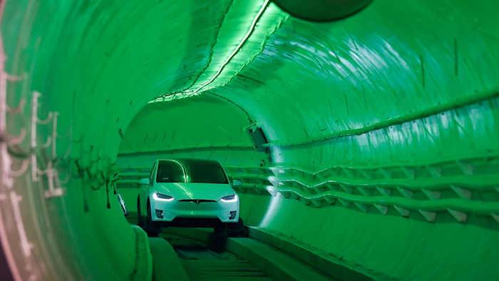 Elon Musk, co-founder and chief executive officer of Tesla Inc., arrives in a modified Tesla Model X electric vehicle during an unveiling event for the Boring Company Hawthorne test tunnel in Hawthorne, Calif., on Tuesday, Dec. 18, 2018. Musk unveiled his underground transportation tunnel on Tuesday, allowing reporters and invited guests to take some of the first rides in the revolutionary albeit bumpy subterranean tube — the tech entrepreneur's answer to what he calls 'soul-destroying traffic.'