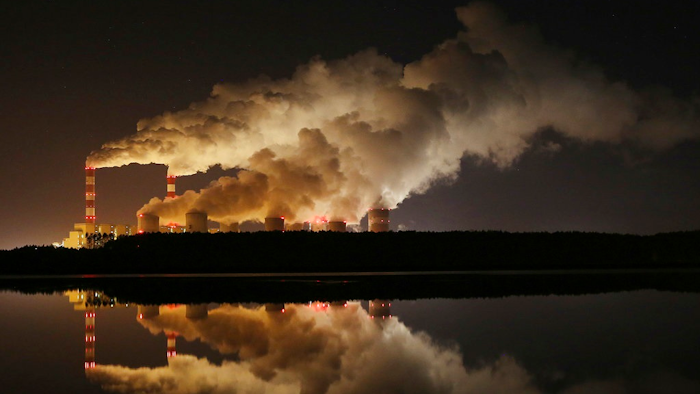 In this Wednesday, Nov. 28, 2018 file photo, plumes of smoke rise from Europe's largest lignite power plant in Belchatow, central Poland. After several years of little growth, global emissions of heat-trapping carbon dioxide surged in 2018 with the largest jump in seven years, discouraged scientists announced Wednesday, Dec. 5, 2018.