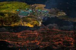 Lava from the Kilauea volcano flows near the Puna Geothermal Venture power plant on Sunday, June 10, 2018, in Pahoa, Hawaii.