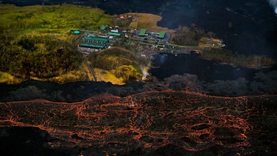 Lava from the Kilauea volcano flows near the Puna Geothermal Venture power plant on Sunday, June 10, 2018, in Pahoa, Hawaii.