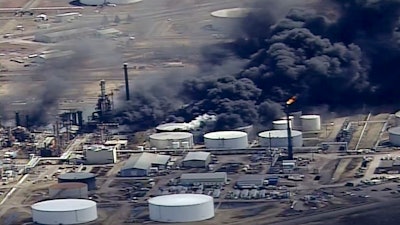 In this April 26, 2018 file image from video, smoke rises from the Husky Energy oil refinery after an explosion and fire at the plant in Superior, Wisconsin.