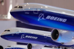 In this Nov. 6, 2018, file photo models of a Boeing passenger airliner are displayed during the 12th China International Aviation and Aerospace Exhibition, also known as Airshow China 2018, in Zhuhai city, south China's Guangdong province. Boeing is buying a majority stake in Embraer’s commercial aircraft and services operations for $4.2 billion. The joint venture announced Monday, Dec. 17, gives Boeing 80 percent ownership of those operations, with Embraer owning the remaining stake.