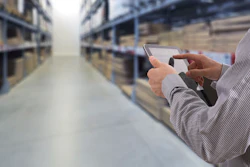 Businessman Stock Room Tablet 000063269441 Large