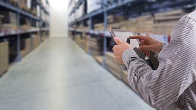 Businessman Stock Room Tablet 000063269441 Large