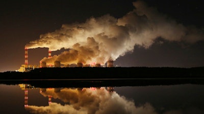 In this Wednesday, Nov. 28, 2018 file photo, plumes of smoke rise from Europe's largest lignite power plant in Belchatow, central Poland. After several years of little growth, global emissions of heat-trapping carbon dioxide surged in 2018 with the largest jump in seven years, discouraged scientists announced Wednesday, Dec. 5, 2018.