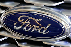 This Feb. 15, 2018 photo shows a Ford logo on display at the Pittsburgh Auto Show in Pittsburgh. Ford is recalling more than 410,000 F-Series pickup trucks with engine block heaters in the U.S. because they can catch fire. The recall covers certain F-150s from the 2015 through 2019 model years, as well as the 2017 through 2019 F-250, 350, 450 and 550. The company says in government documents posted Friday, Dec. 21, 2018, that water and contaminants can get into the heater cable and cause corrosion.