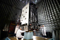 This March 22, 2016, photo provided by Lockheed Martin shows the first GPS III satellite inside the anechoic test facility at Lockheed Martin's complex south of Denver. The facility is used to ensure the signals from the satellite's components and payload will not interfere with each other. The satellite is scheduled to be launched from Cape Canaveral, Fla., on Tuesday, Dec. 18, 2018.