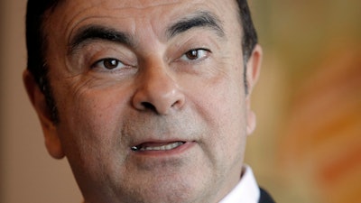 In this file photo, then Nissan Chairman Carlos Ghosn speaks during an interview in Hong Kong. Japan's court has denied the prosecutor's request to extend detention of ex-Nissan chair Carlos Ghosn.