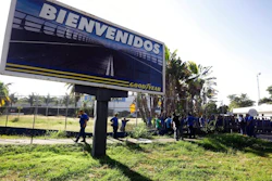 A Goodyear billboard emblazoned with the Spanish word for welcome, is posted near a plant entrance company where workers arrived to find the plant is no longer in operation, in Los Guayabos, Venezuela, Monday, Dec. 10, 2018. U.S. tire company Goodyear announced it will no longer continue production in Venezuela as economic conditions in the South American nation continue to deteriorate.