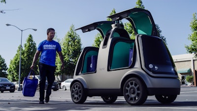 This image shows an autonomous vehicle called the R1. Nuro and grocery chain Kroger are teaming up to bring unmanned delivery service to customers.