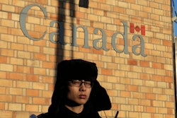 A policeman stands watch outside the Canadian Embassy in Beijing.