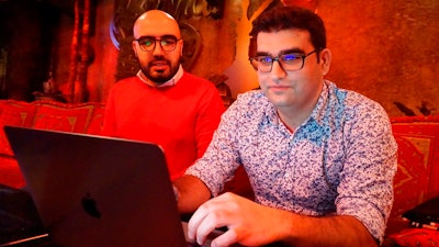 Certfa researchers Nariman Gharib, left, and Amin Sabeti look at a computer at a cafe in London on Friday, Dec. 7, 2018. The Associated Press drew on data gathered by the London-based cybersecurity group Certfa to track how a hacking group often nicknamed Charming Kitten spent the past month trying to break into the private emails of more than a dozen U.S. Treasury officials. Also on the hackers’ hit list: high-profile defenders, detractors and enforcers of the nuclear deal struck between Washington and Tehran, as well as Arab atomic scientists, Iranian civil society figures and D.C. think tank employees.