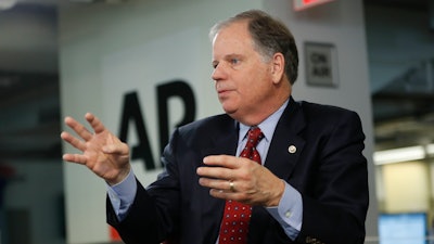 Sen. Doug Jones, D-Ala., speaks during an interview at the Associated Press.