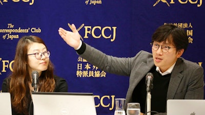 Lim Jae-sung, plaintiffs' attorney, speaks as Kim Se-eun, left, plaintiffs' attorney, listens during a press conference in Tokyo, Tuesday, Dec. 4, 2018. The two lawyers for Korean forced laborers demanded Nippon Steel & Sumitomo Metal Corp., a Japanese steelmaker, respond to their request to discuss compensation by Christmas, or they will take legal step to freeze its assets in their country.
