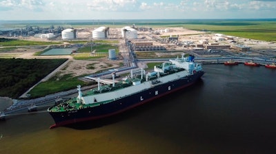 In this July 6, 2018 photo, a carrier ship for liquefied natural gas (LNG) is docked at Cheniere’s Sabine Pass Terminal in Cameron Parish, La. By specifically promoting LNG exports, the U.S. government is helping guarantee the success of a handful of companies _ using taxpayer dollars to boost a nascent industry it also regulates. Houston-based Cheniere has benefited from the government’s LNG push.