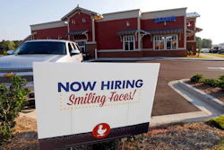 This July 25, 2018, file photo shows a help wanted sign at a new Zaxby's restaurant in Madison, Miss. On Monday, Dec. 10, the Labor Department reports on job openings and labor turnover for October.