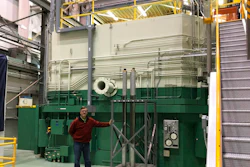 In this Nov. 29, 2018 photo, J.R. Biggs stands in front of the Transient Test Reactor he manages about 50 miles west of Idaho Falls, Idaho. The test reactor at the Idaho National Laboratory has been restarted to test nuclear fuels as the U.S. tries to revamp a fading nuclear power industry with safer fuel designs and a new generation of power plants.