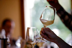 In this image taken on Monday, Oct. 15, 2018, an expert wine tester shakes a glass of Prosecco during a wine testing at the Case Paolin farm, in Volpago del Montello, Italy. Prosecco has become the best-selling sparkling wine in the world, and experts say it is eroding the more casual corner of champagne's market while aiming higher. Its production eclipsed champagne's five years ago and is now 75 percent higher at 544,000 bottles three-quarters of which for export.0 bottles three-quarters of which for export.