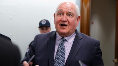 In this file photo, Agriculture Secretary Sonny Perdue speaks with reporters on Capitol Hill in Washington. The Trump administration is setting out to accomplish what this year’s farm bill didn’t: Tighten work requirements for millions of Americans who receive federal food assistance.