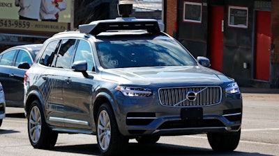 This March 17, 2017, photo shows an Uber self-driving Volvo in Pittsburgh. The Pennsylvania Department of Transportation has approved Uber's request to resume testing of autonomous vehicles on public roads in the Pittsburgh area. The approval, effective Monday, Dec. 17, 2018, and lasting for one year, comes about nine months after one of Uber's autonomous test vehicles hit and killed an Arizona pedestrian. Testing was suspended after March 18 crash in Tempe, Arizona.