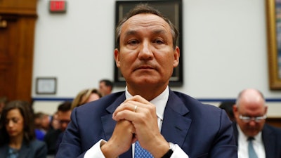 In this May 2, 2017 file photo, United Airlines CEO Oscar Munoz prepares to testify on Capitol Hill in Washington, before a House Transportation Committee oversight hearing. Munoz says his pilots don’t need any additional training on the new Boeing jet that is at the center of the investigation into a deadly crash in Indonesia. Munoz spoke to reporters Wednesday, Dec. 12, 2018 and said the Boeing 737 MAX is safe and reliable.