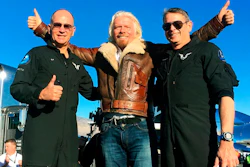 Richard Branson center celebrates with pilots Rick “CJ” Sturckow, left, and Mark “Forger” Stucky, right, after Virgin Galactic’s tourism spaceship climbed more than 50 miles high above California’s Mojave Desert on Thursday, Dec. 13, 2018. The rocket ship reached an altitude of 51 miles (82 kilometers) before beginning its gliding descent, said mission official Enrico Palermo. The craft landed on a runway minutes later.