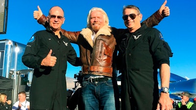 Richard Branson center celebrates with pilots Rick “CJ” Sturckow, left, and Mark “Forger” Stucky, right, after Virgin Galactic’s tourism spaceship climbed more than 50 miles high above California’s Mojave Desert on Thursday, Dec. 13, 2018. The rocket ship reached an altitude of 51 miles (82 kilometers) before beginning its gliding descent, said mission official Enrico Palermo. The craft landed on a runway minutes later.