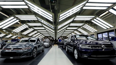 In this Thursday, March 8, 2018 file photo Volkswagen cars are pictured during a final quality control at the Volkswagen plant in Wolfsburg, Germany. Automaker Volkswagen says it is on track for a new annual sales record despite troubles getting vehicles certified for new European emissions tests.