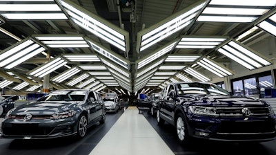 In this Thursday, March 8, 2018 file photo Volkswagen cars are pictured during a final quality control at the Volkswagen plant in Wolfsburg, Germany. Automaker Volkswagen says it is on track for a new annual sales record despite troubles getting vehicles certified for new European emissions tests.