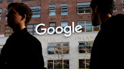 In this Dec. 4, 2017 file photo, people walk by Google offices in New York. Google is still having trouble protecting the personal information on its Plus service, prodding the company to accelerate its plans to shut down a little-used social network created to compete against Facebook.