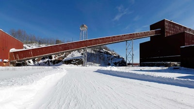 This Feb. 10, 2016, file photo shows a former iron ore processing plant near Hoyt Lakes, Minn., that would become part of a proposed PolyMet copper-nickel mine. The Minnesota Pollution Control Agency announced its approval of the air and water quality permits for the project and a certification of the company's plan to mitigate the mine's impact on wetlands. The only remaining major permit is a wetlands permit from the Army Corps of Engineers.