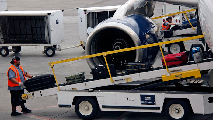 Loading baggage by hand is more reliable than automated systems.