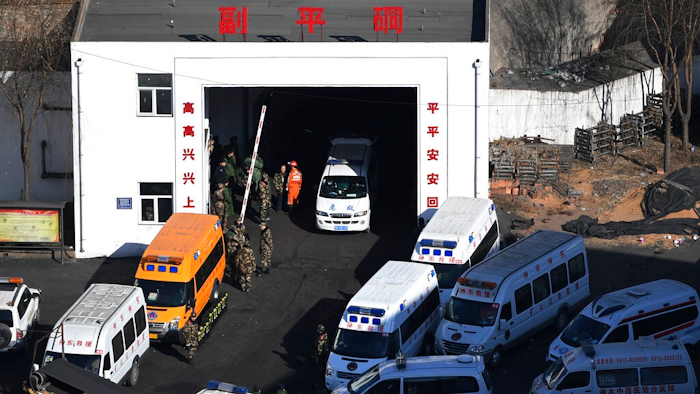 In this photo released by Xinhua News Agency, ambulance vehicles and rescuers gather at the Lijiagou coal mine of the Baiji Mining Co., Ltd. in Shenmu City, northwest China's Shaanxi Province, Sunday, Jan. 13, 2019. Twenty-one coal miners were killed when a mine collapsed in northern China, state media reported Sunday.
