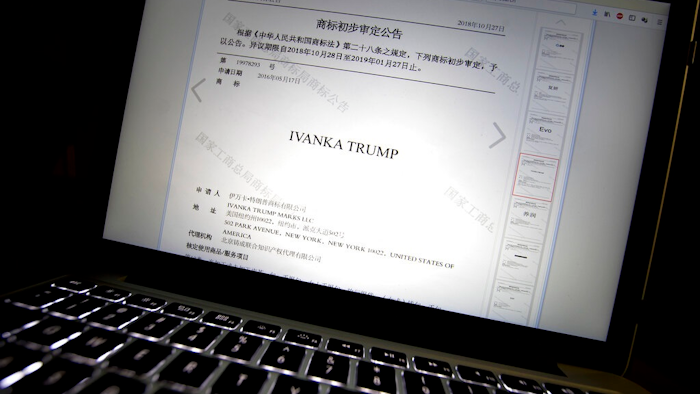 In this Nov. 6, 2018, file photo, a document from the website of China's Trademark Office of the State Administration for Industry and Commerce showing provisional approval of a trademark for Ivanka Trump Marks LLC is seen on a computer screen in Beijing. China has greenlighted five more Ivanka Trump trademarks as trade talks with her father’s administration intensify. They cover a range from wedding dresses to insurance and art valuation services.