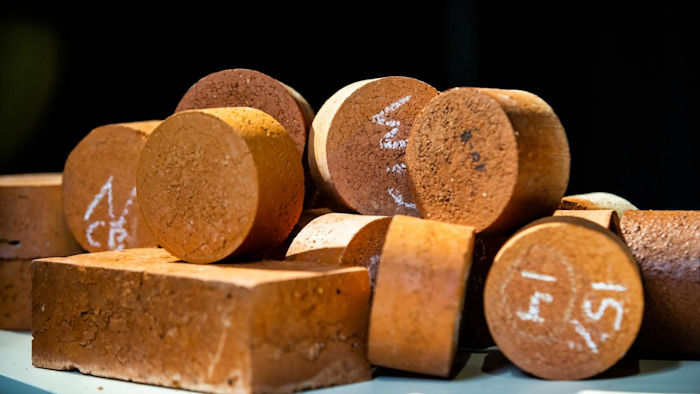 Fired-clay bricks incorporating biosolids.