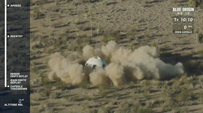 In this image from video made available by Blue Origin, the New Shepard capsule lands at the company's site in west Texas. Jeff Bezos' rocket company launched NASA experiments into space on the brief test flight.
